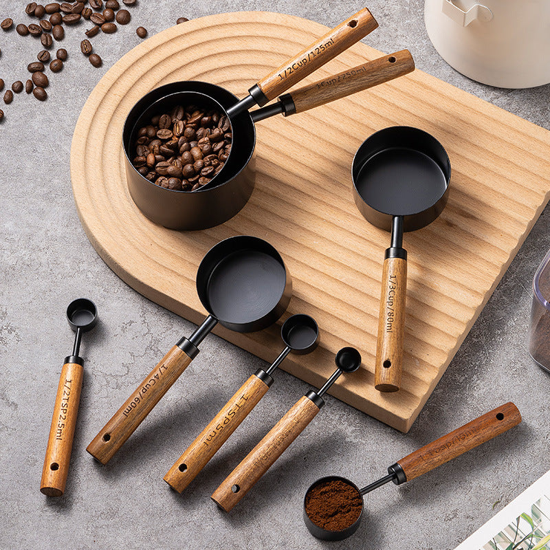 Blent10 8-piece stainless steel measuring cup and spoon set with walnut wood handles and scale markings